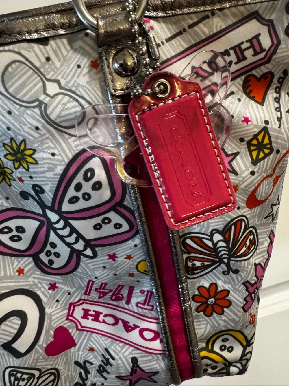 Coach Poppy Metallic Silver Tote with Pink Accent and Butterfly Print